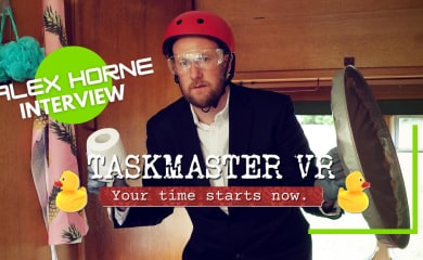 Alex Horne in Taskmaster holding a toilet roll and a garbage can lid while wearing a helmet.