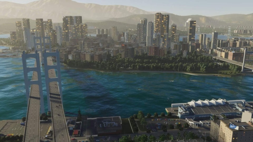 A zoomed-out view of a city by the water in Cities: Skylines 2