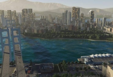 A zoomed-out view of a city by the water in Cities: Skylines 2