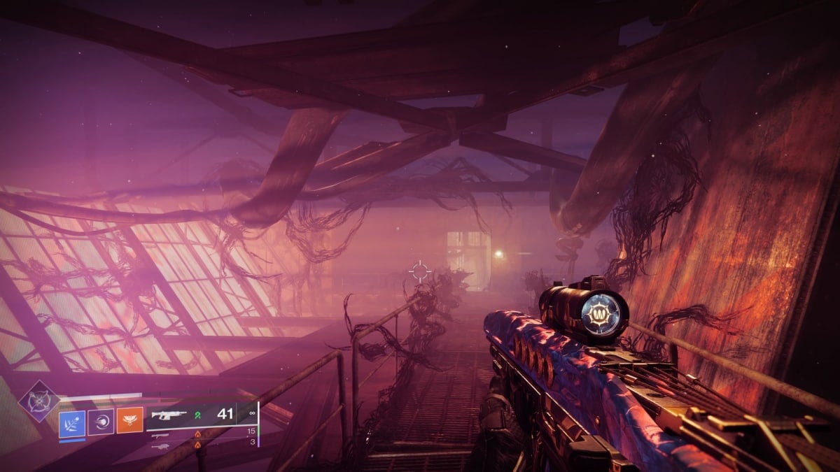 A screenshot from Destiny 2: The Final Shape, showing a gloomy factory interior corrupted by large black tendrils