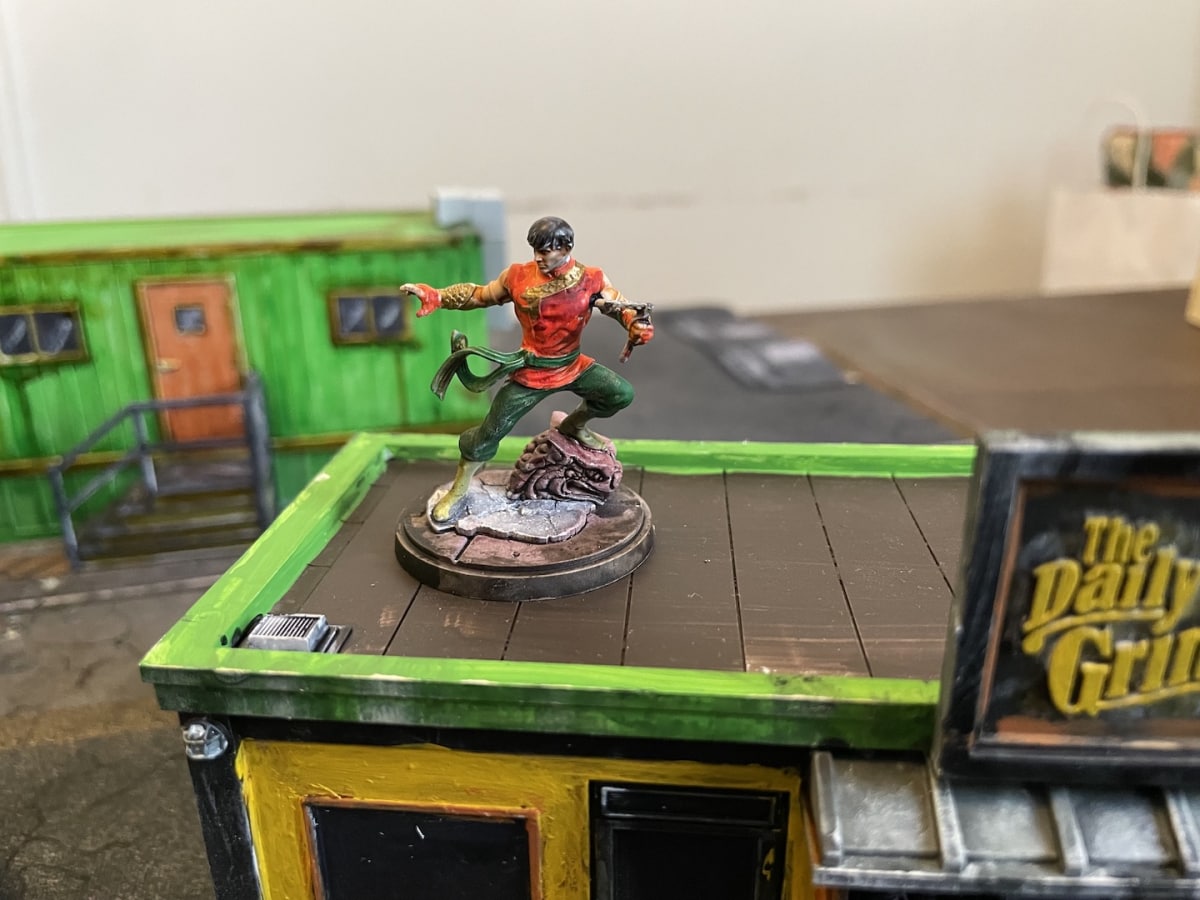 AN IMAGE of Shang-Chi posted up on top of the Daily Grind ready to strike in Marvel: Crisis Protocol