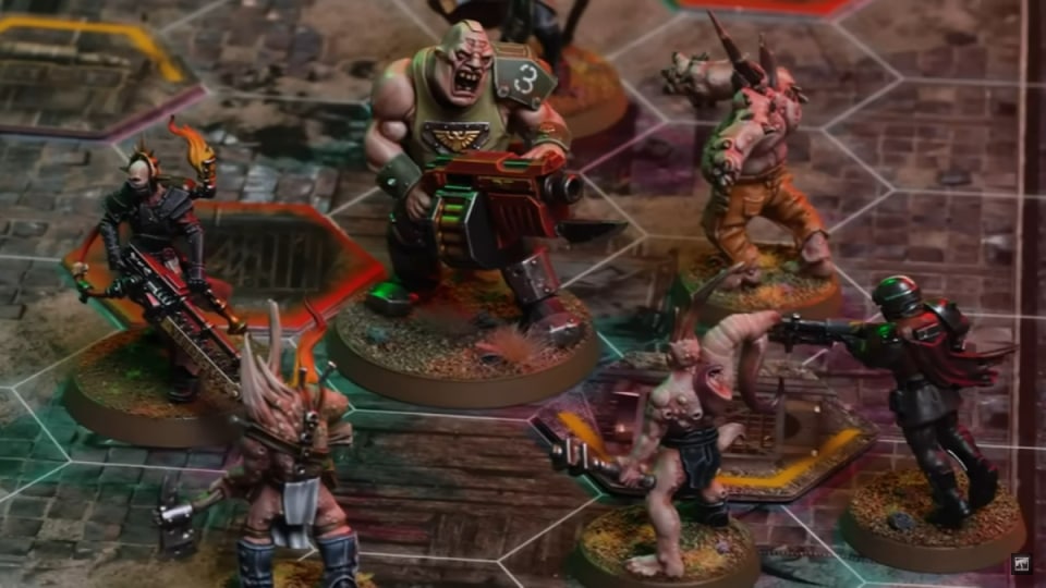 A screenshot of the Warhammer 40,000 Darktide board game, showing a handful of miniatures and dice on a skirmish map.