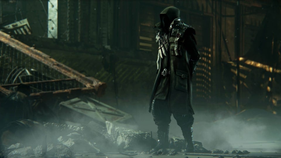 A mysterious hooded figure standing amidst smoky ruins in the Warhammer 40k: Darktide Secrets of the Machine God update